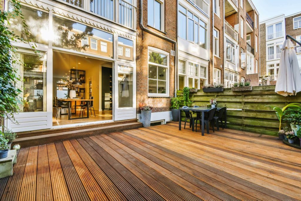 a view of a backyard patio in a townhouse